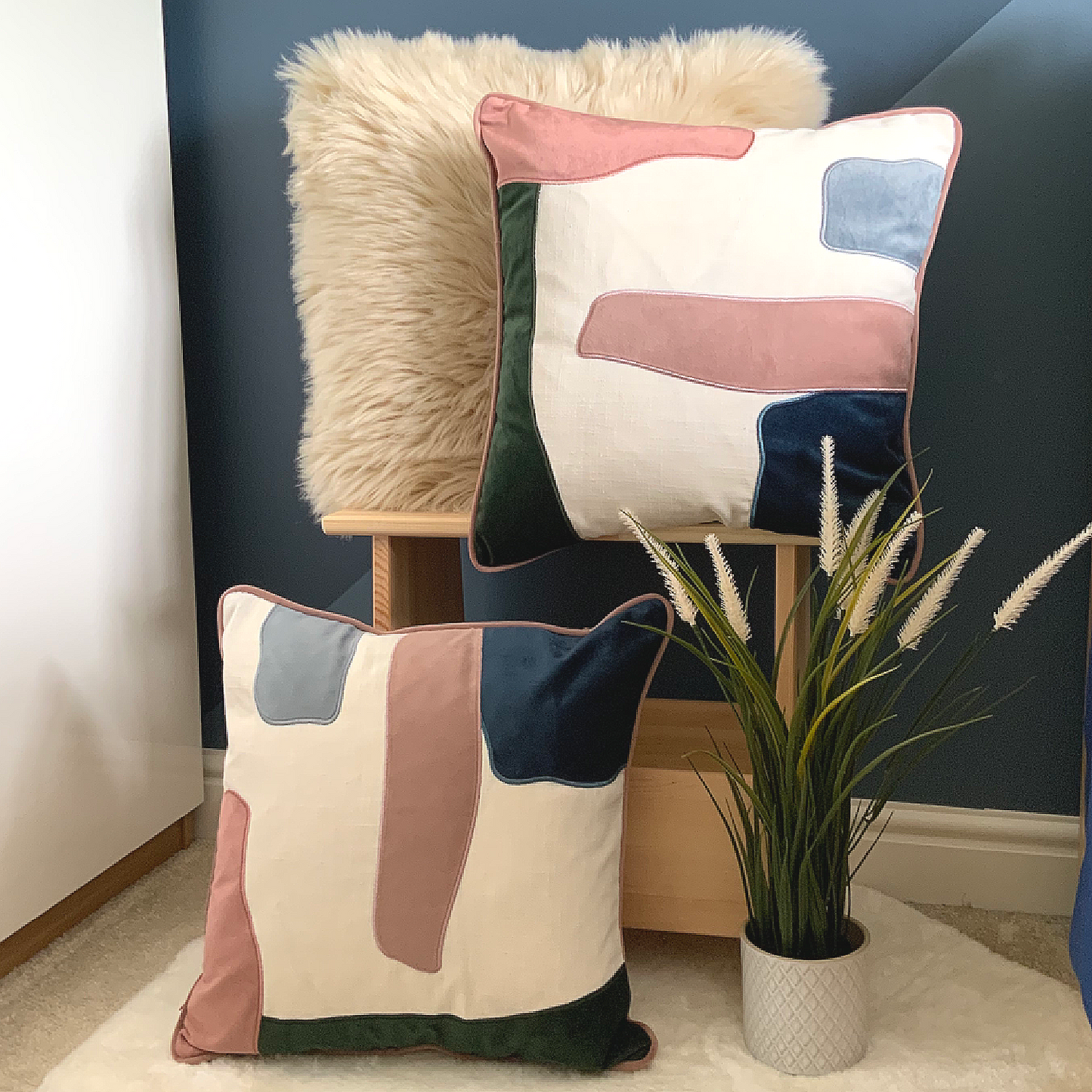 This Prem Abstract Cushion is perfect for achieving a contemporary décor in your home. Its unique design features pink, green, white and blue abstract pattern, and is crafted with high quality velvet with a contrast trim. It is feather filled and measures 45 x 45 cm, making it the perfect addition to your sofa, bed, or armchair. Add this statement piece to your home for a stylish finishing touch, the perfect cushion for your bed or sofa. Available as a filled cushion.