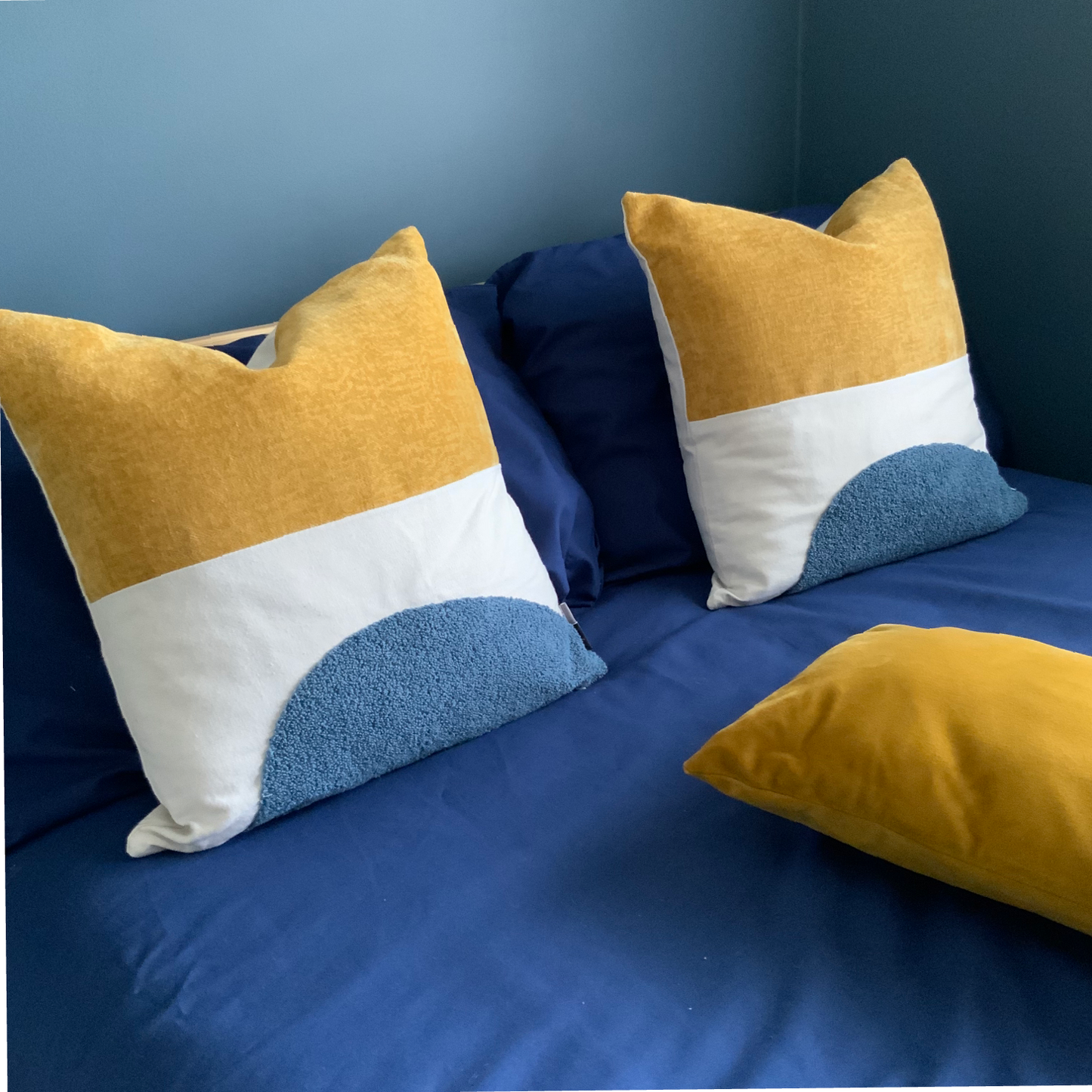 Mustard and blue cushion, velvet, canvas and wool texture finish.