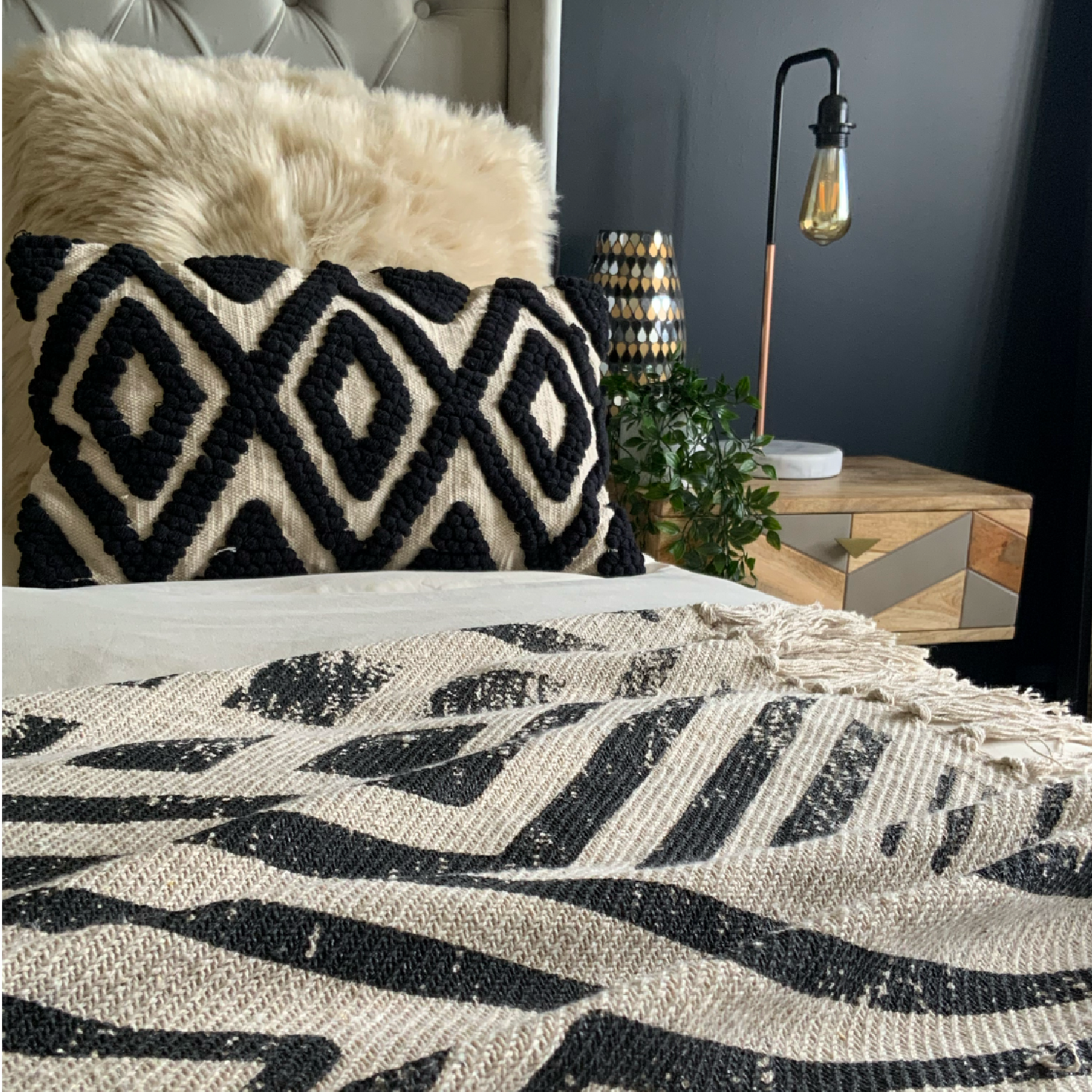 The Black Kiera cushion is a cotton, hand tufted, woven cushion. Exclusively designed by Cultured Home founder Pratisha. This statement pillow has a striking black tufted, diamond pattern, against a woven beige background, making it the perfect accessory to add a little flair to any bed, sofa or space. This is a highly quality, rustic cushion and dry clean only. All cushions are handmade and can vary slightly in pattern and size from the images shown. This cushion is size 30 x 50cm.