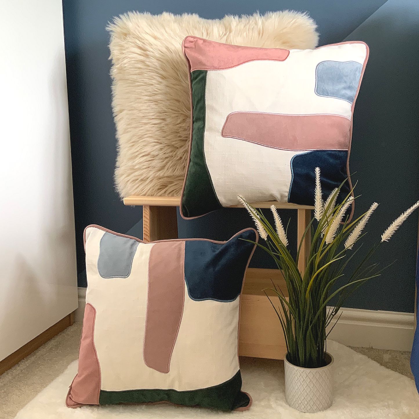 This Prem Abstract Cushion is perfect for achieving a contemporary décor in your home. Its unique design features pink, green, white and blue abstract pattern, and is crafted with high quality velvet with a contrast trim. It is feather filled and measures 45 x 45 cm, making it the perfect addition to your sofa, bed, or armchair. Add this statement piece to your home for a stylish finishing touch, the perfect cushion for your bed or sofa. Available as a filled cushion. 