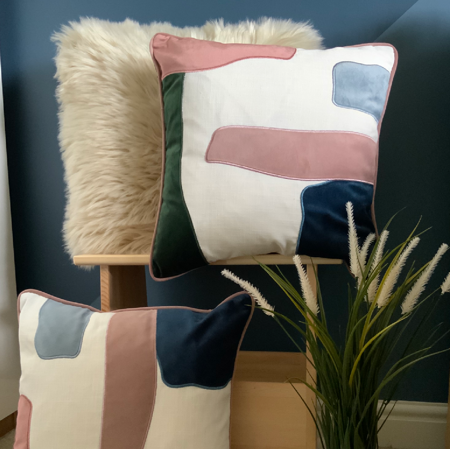 Abstract, multicoloured velvet cushion, contemporary design cushion with a contrast trim, feather filled cushion