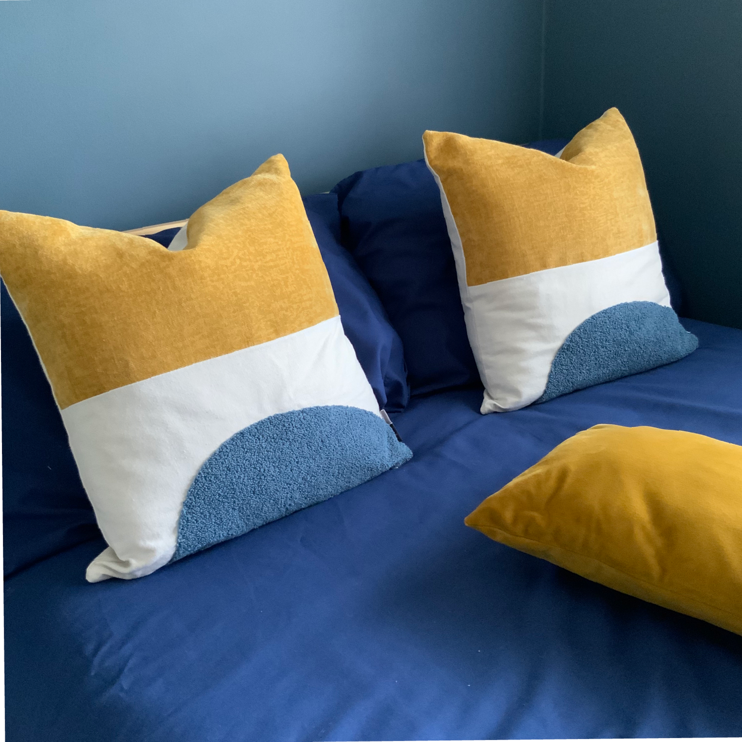 Mustard and blue cushion, velvet, canvas and wool texture finish. 