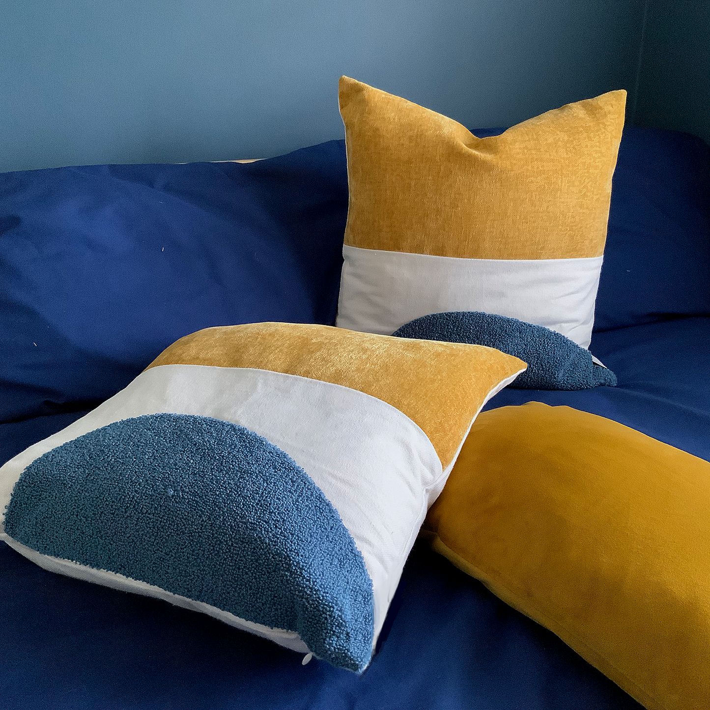 Mustard and blue cushion, velvet, canvas and wool texture finish. 