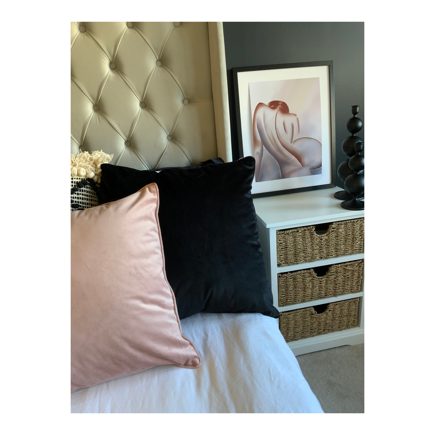 Framed print on a bedside table