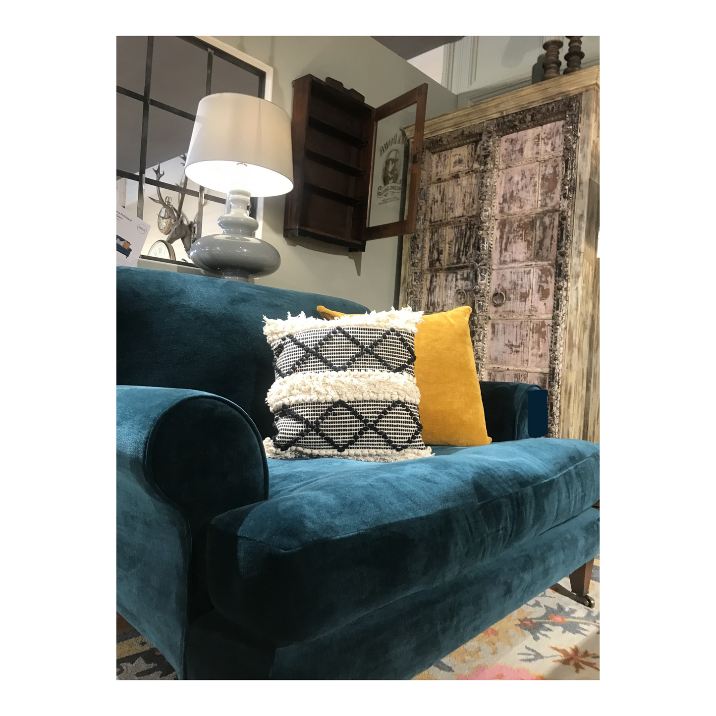 Designer cushions on a blue chair