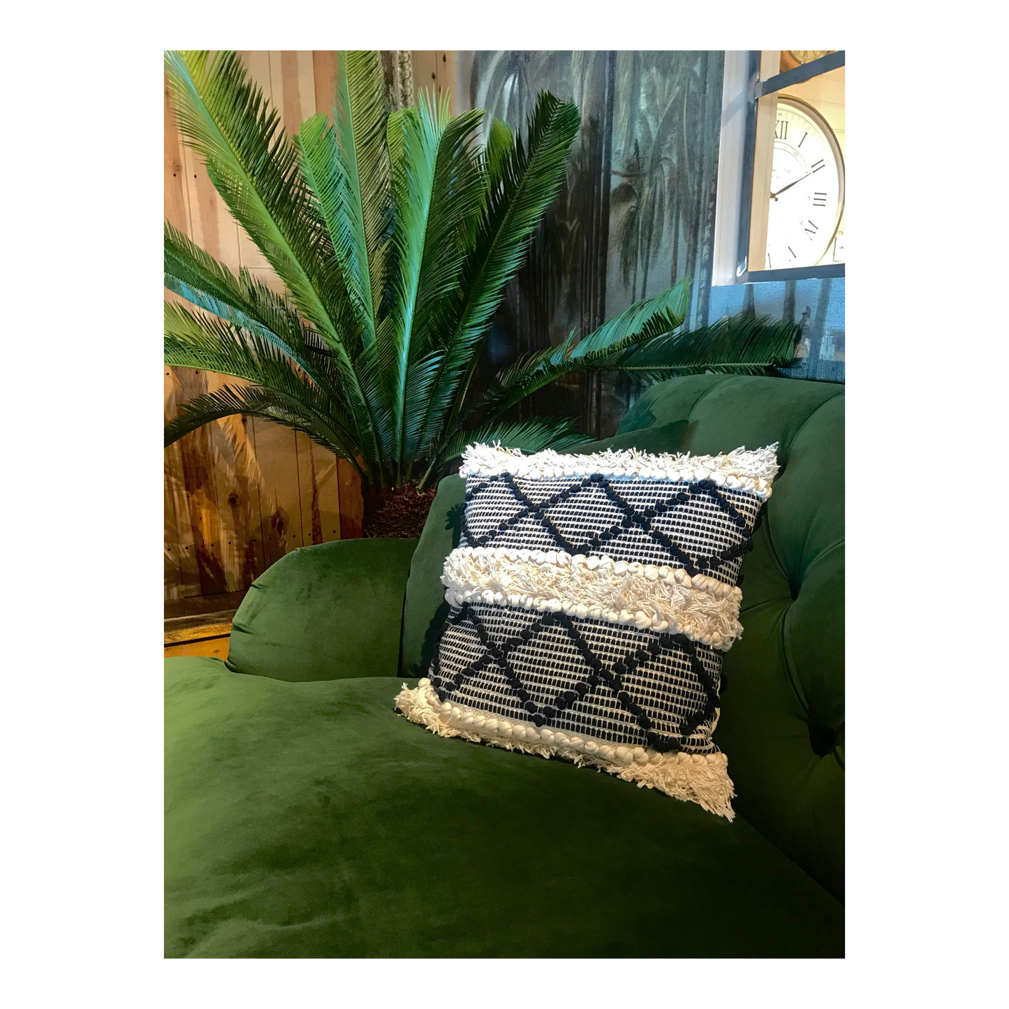 Cross weave throw pillow on top of a green sofa